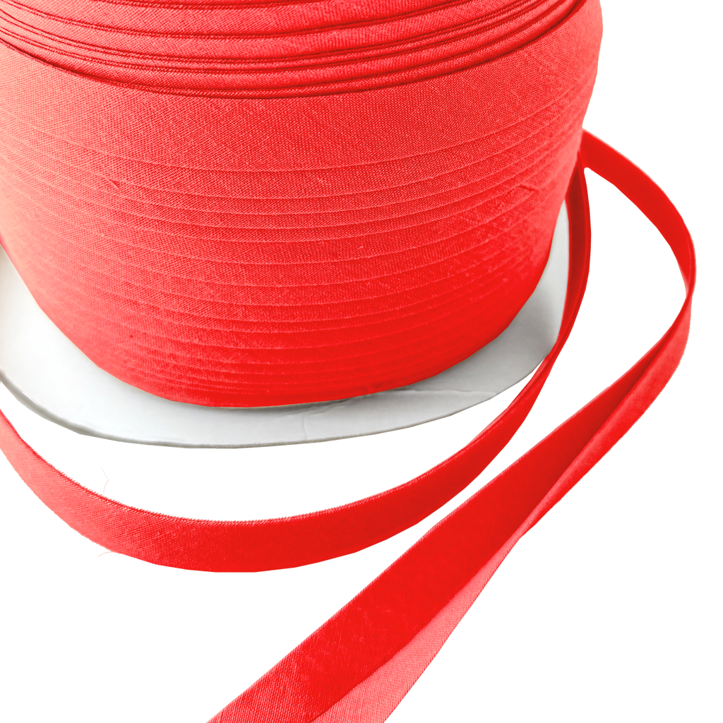 close up of the apple red 1/2" double fold bias tape on a spool from Heit's Wholesale bulk sewing supply company
