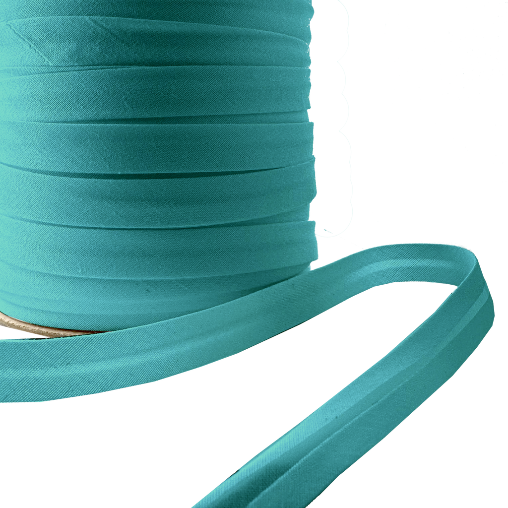 close up of the aquarius 1/2" single fold bias tape on a spool from Heit's Wholesale bulk sewing supply company