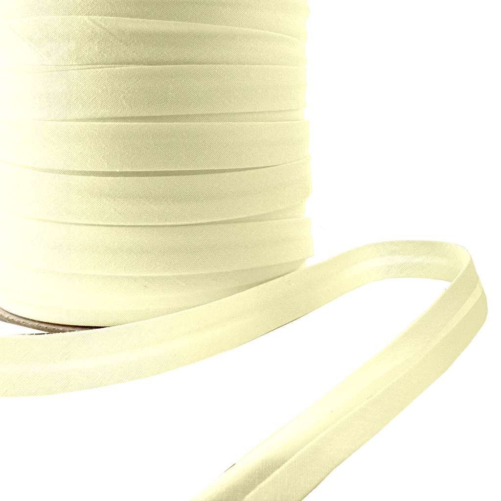 close up of the bamboo 1/2" single fold bias tape on a spool from Heit's Wholesale bulk sewing supply company