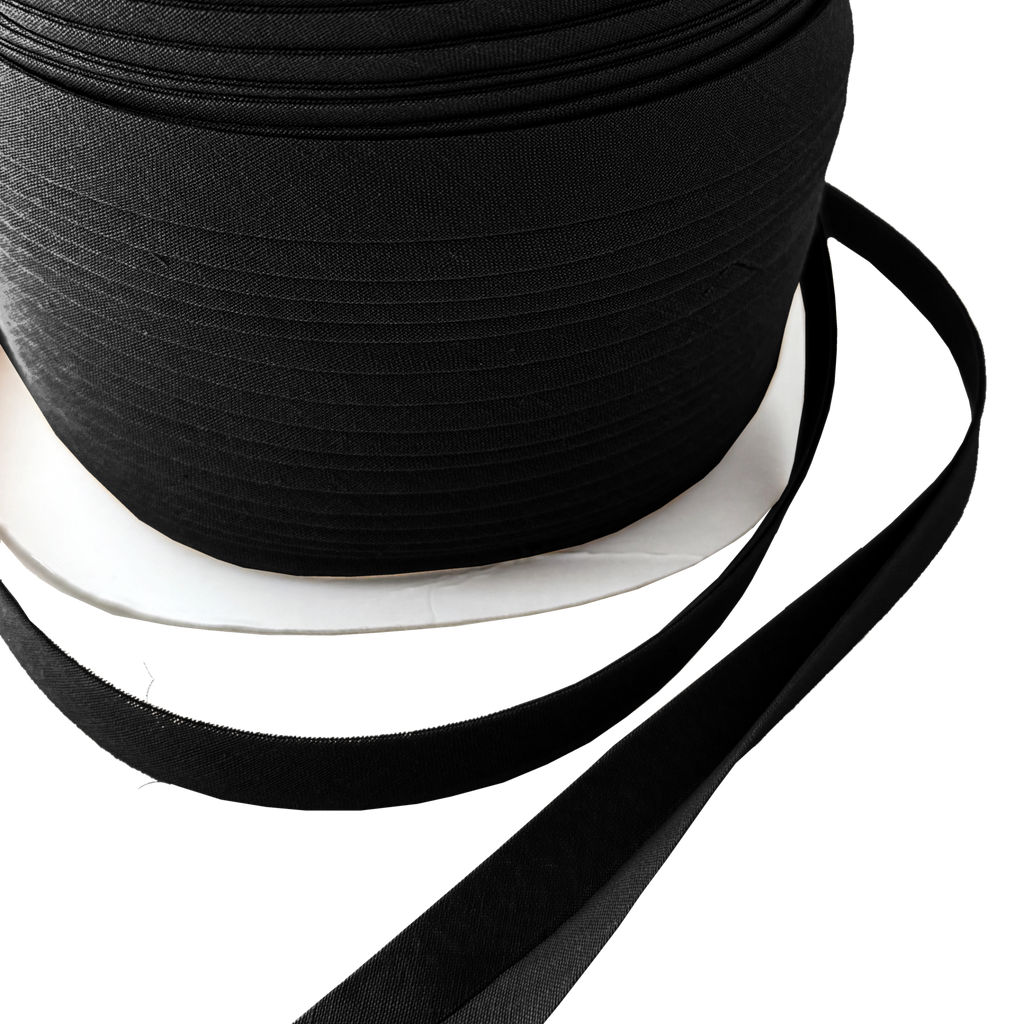 close up of the black 1/2" double fold bias tape on a spool from Heit's Wholesale bulk sewing supply company