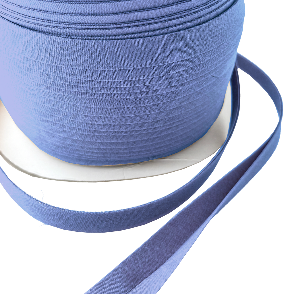 close up of the blue crest 1/2" double fold bias tape on a spool from Heit's Wholesale bulk sewing supply 
