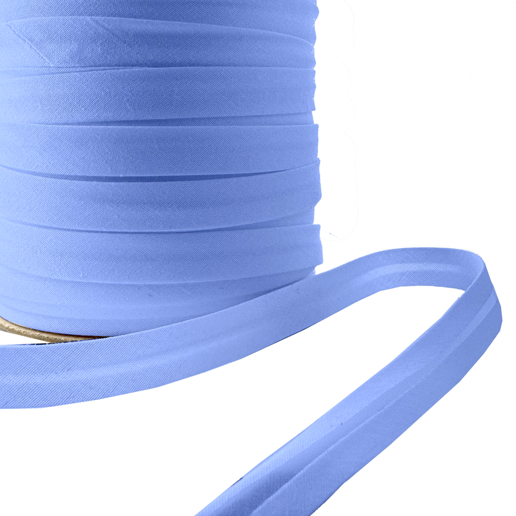 close up of the blue crest 1/2" single fold bias tape on a spool from Heit's Wholesale bulk sewing supply company