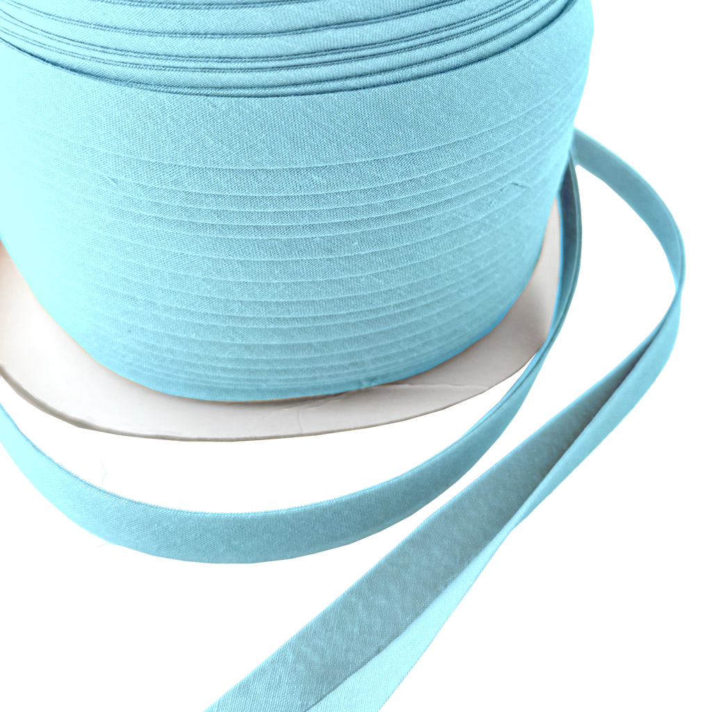 close up of the blue 1/2" double fold bias tape on a spool from Heit's Wholesale bulk sewing supply company