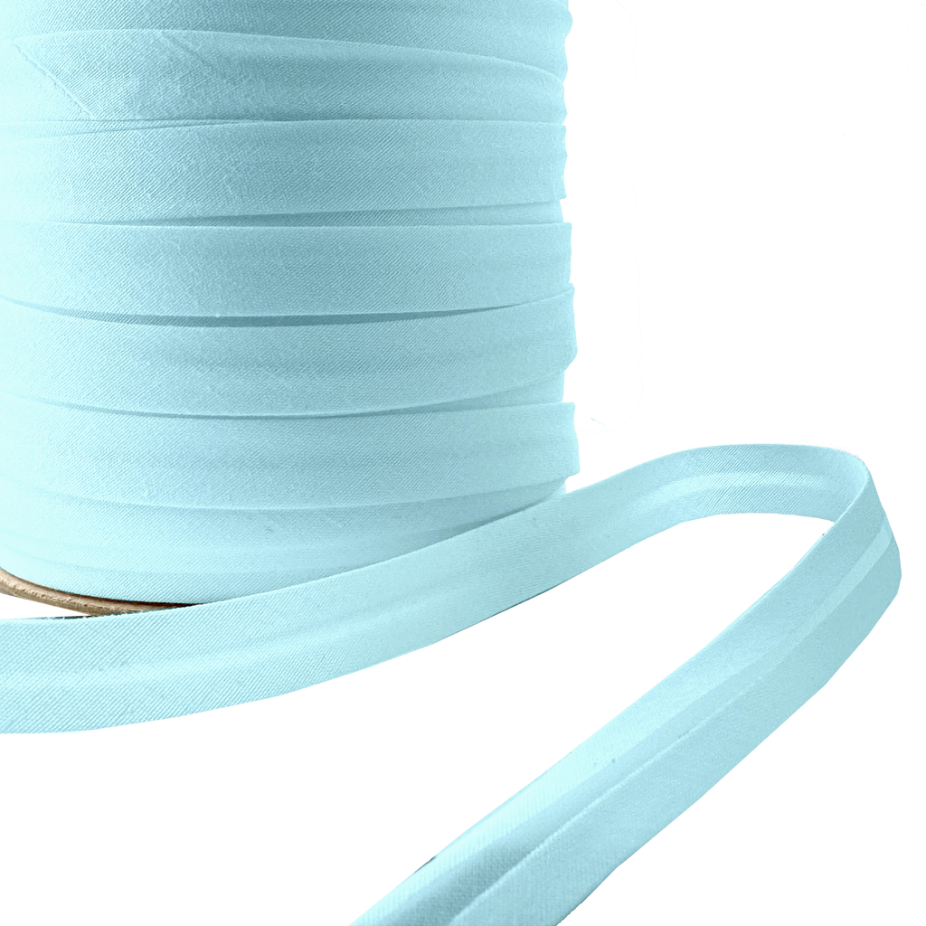 close up of the blue 1/2" single fold bias tape on a spool from Heit's Wholesale bulk sewing supply company