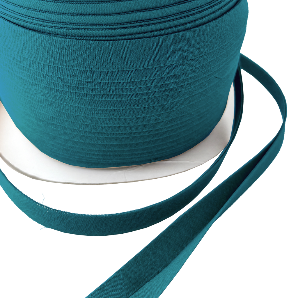 close up of the bottle green 1/2" double fold bias tape on a spool from Heit's Wholesale bulk sewing supply company