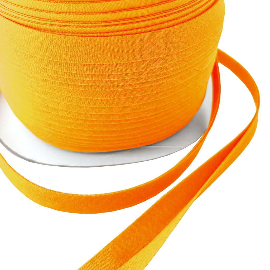 close up of the bright orange 1/2" double fold bias tape on a spool from Heit's Wholesale bulk sewing supply company