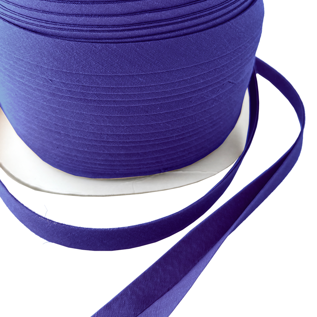 close up of the broker blue 1/2" double fold bias tape on a spool from Heit's Wholesale bulk sewing supply company