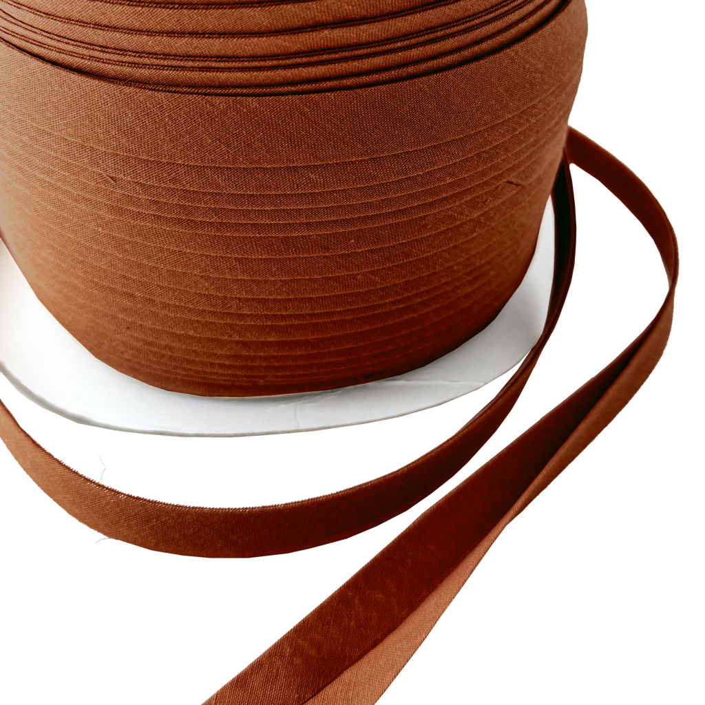 close up of the brown 1/2" double fold bias tape on a spool from Heit's Wholesale bulk sewing supply company