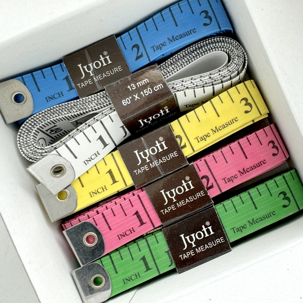 assorted 60" tape measures from Heit's Wholesale bulk sewing supply company