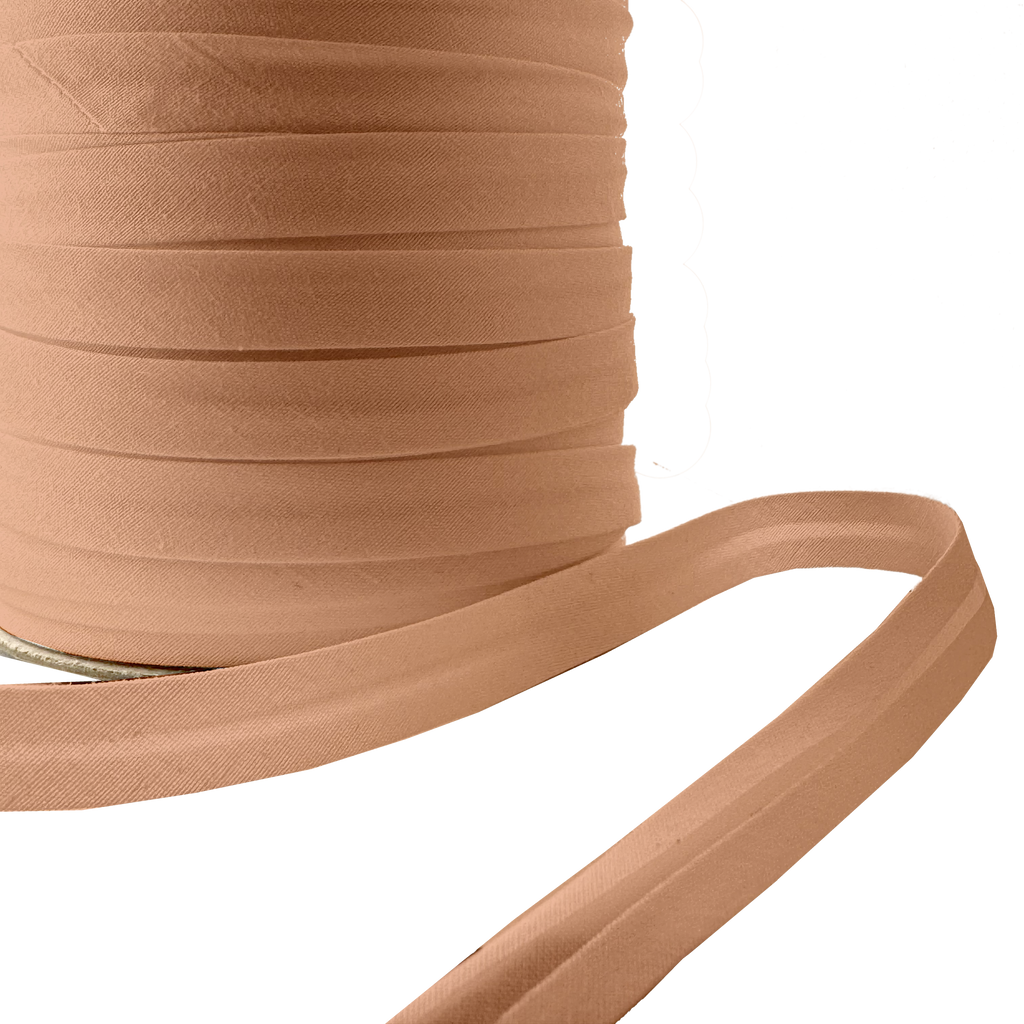 close up with the camel brown 1/2" single fold bias tape on a spool from Heit's Wholesale bulk sewing supply company