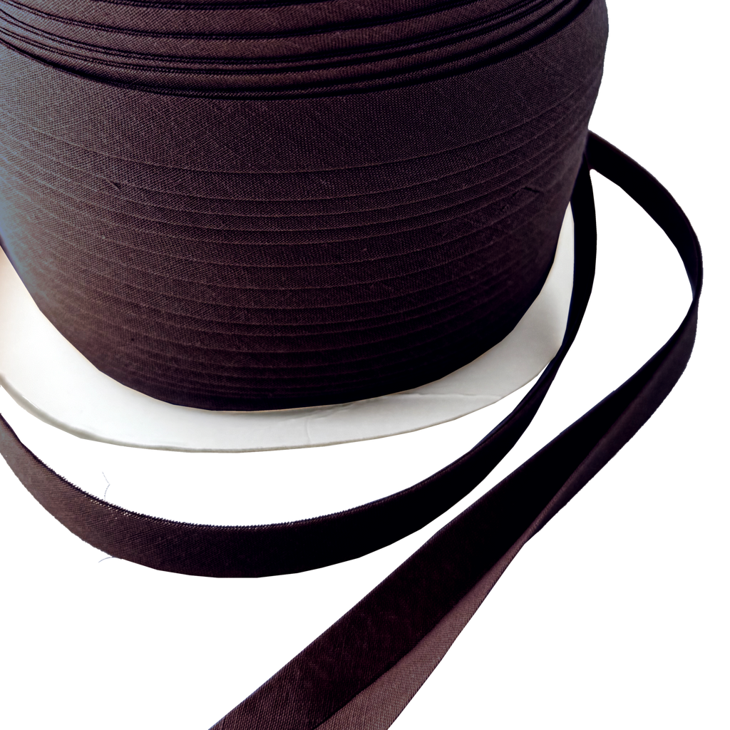 close up of the chocolate brown 1/2" double fold bias tape on a spool from Heit's Wholesale bulk sewing supply company