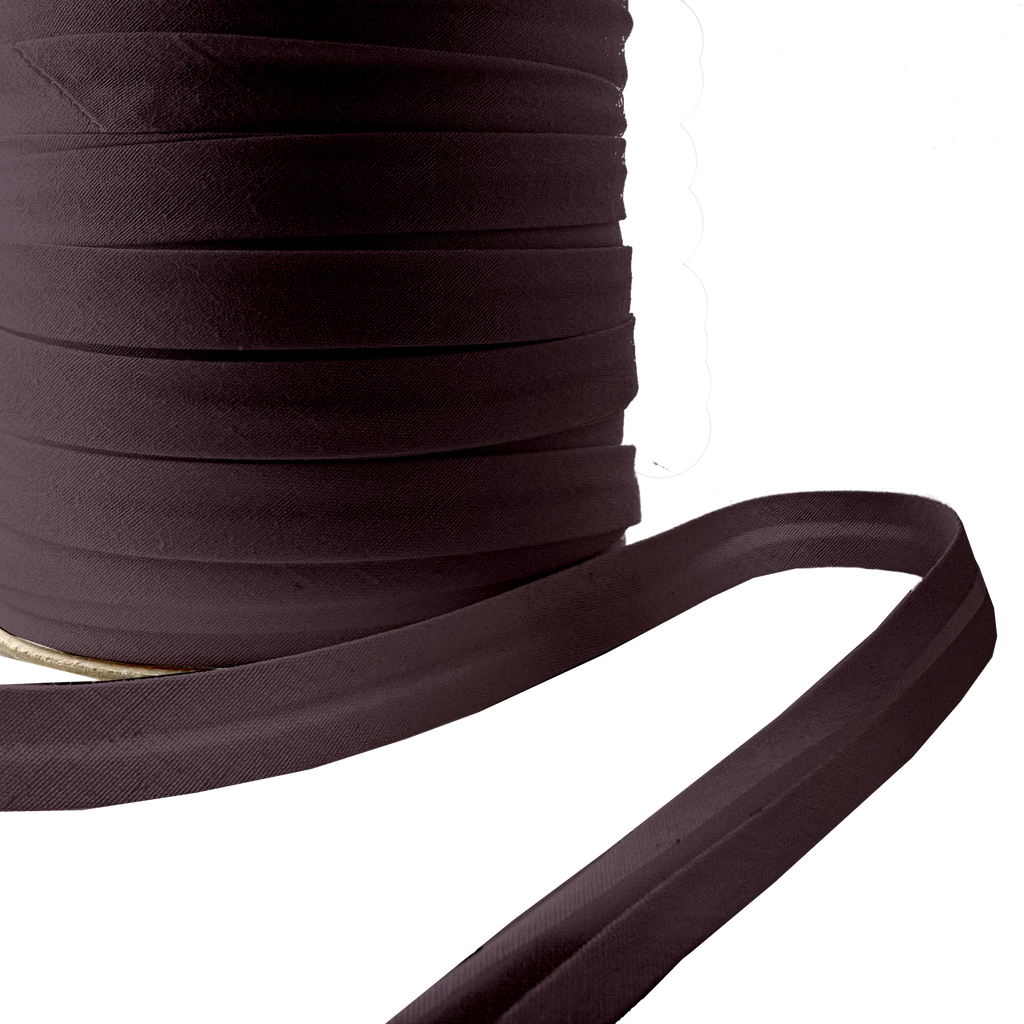 close up of the chocolate brown 1/2" single fold bias tape on a spool from Heit's Wholesale bulk sewing supply company