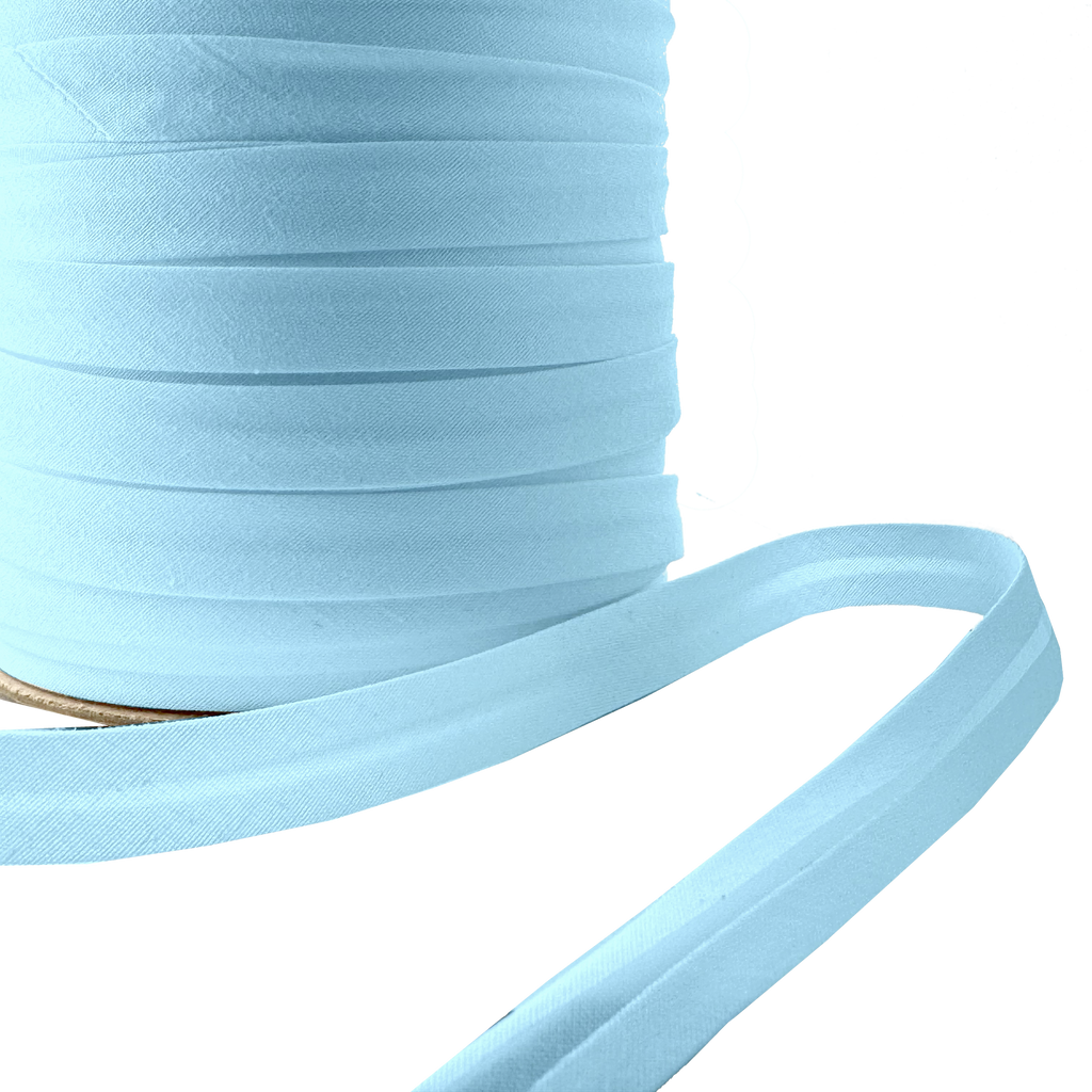 close up of the cloud blue 1/2" single fold bias tape on a spool from Heit's Wholesale bulk sewing supply company