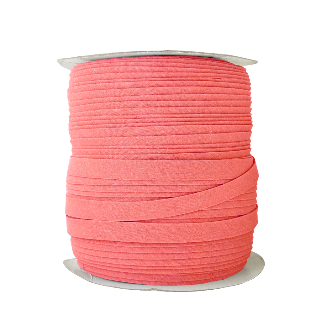 coral 1/2" double fold bias tape on a spool from Heit's Wholesale bulk sewing supply company