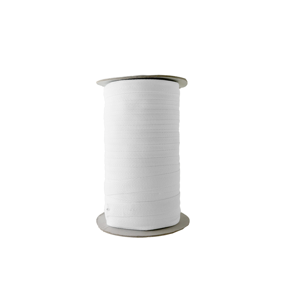 white 1/2" cotton twill tape on a spool from Heit's Wholesale bulk sewing supply company