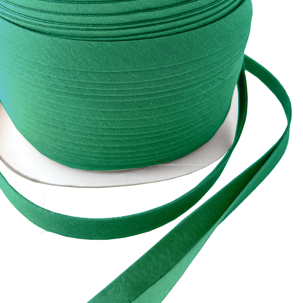 close up of the crystal green 1/2" double fold bias tape on a spool from Heit's Wholesale bulk sewing supply company