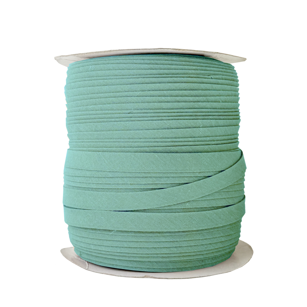 light teal 1/2" double fold bias tape on a spool from Heit's Wholesale bulk sewing supply company