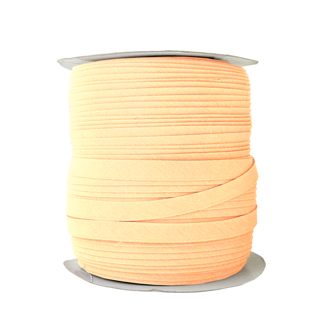 peach cream 1/2" double fold bias tape on a spool from Heit's Wholesale bulk sewing supply company