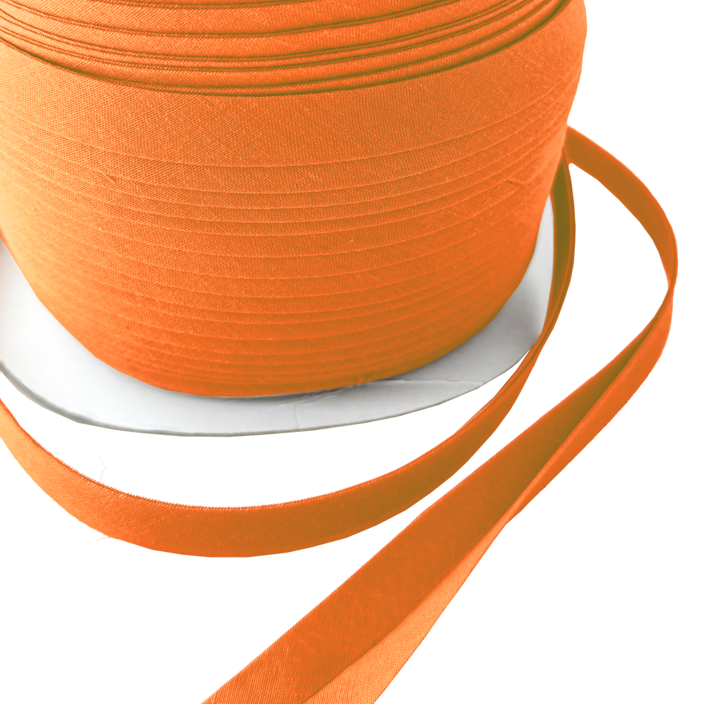 close up of the pumpkin pie orange 1/2" double fold bias tape on a spool from Heit's Wholesale bulk sewing supply company