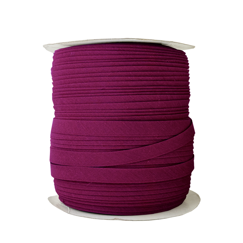 ruby 1/2" double fold bias tape on a spool from Heit's Wholesale bulk sewing supply company