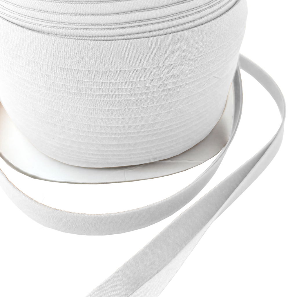 close up of the white 1/2" double fold bias tape on a spool from Heit's Wholesale bulk sewing supply company