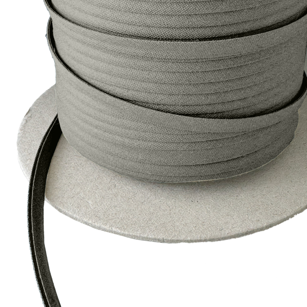 close up of the ash gray 1/4" double fold bias tape on a spool from Heit's Wholesale bulk sewing supply company