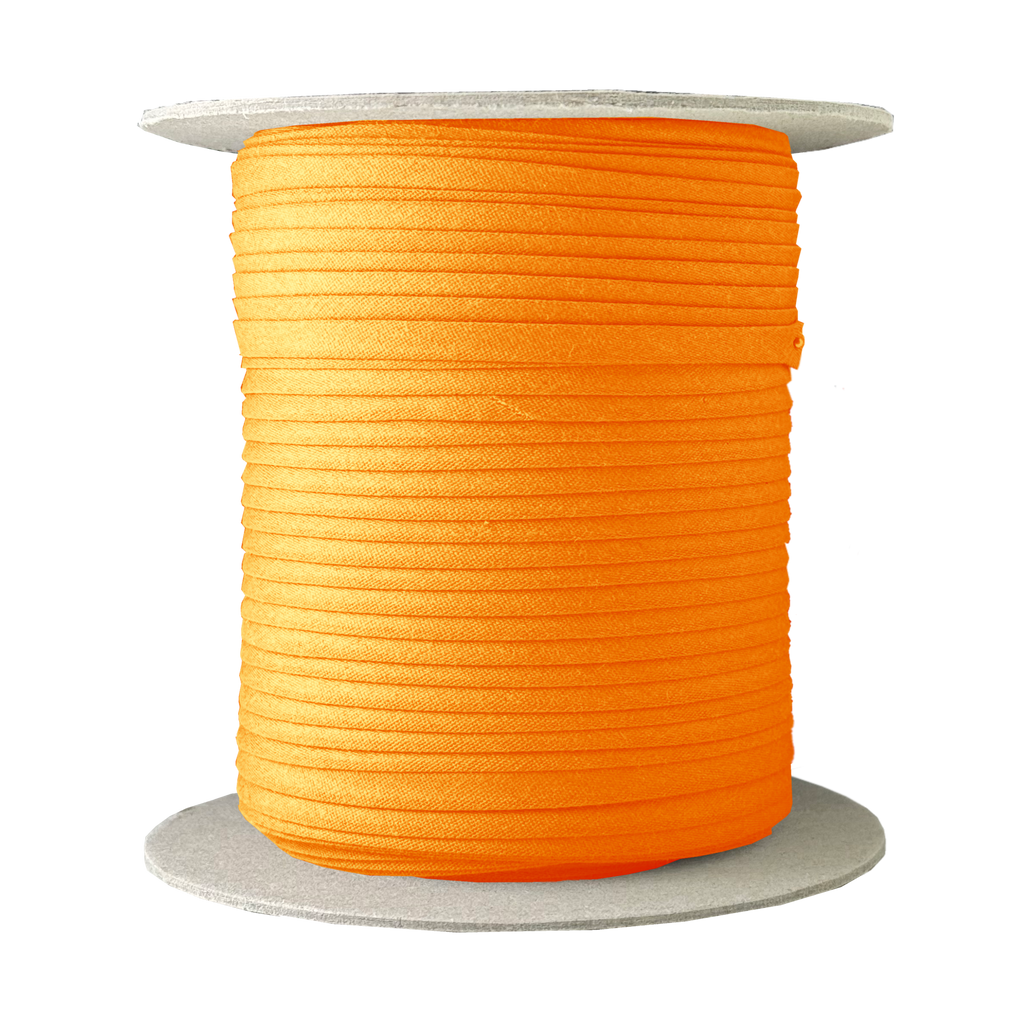bright orange 1/4" double fold bias tape on a spool from Heit's Wholesale bulk sewing supply company