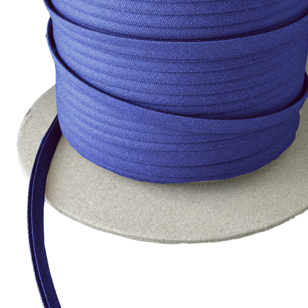 close up of the classic blue 1/4" double fold bias tape on a spool from Heit's Wholesale bulk sewing supply company