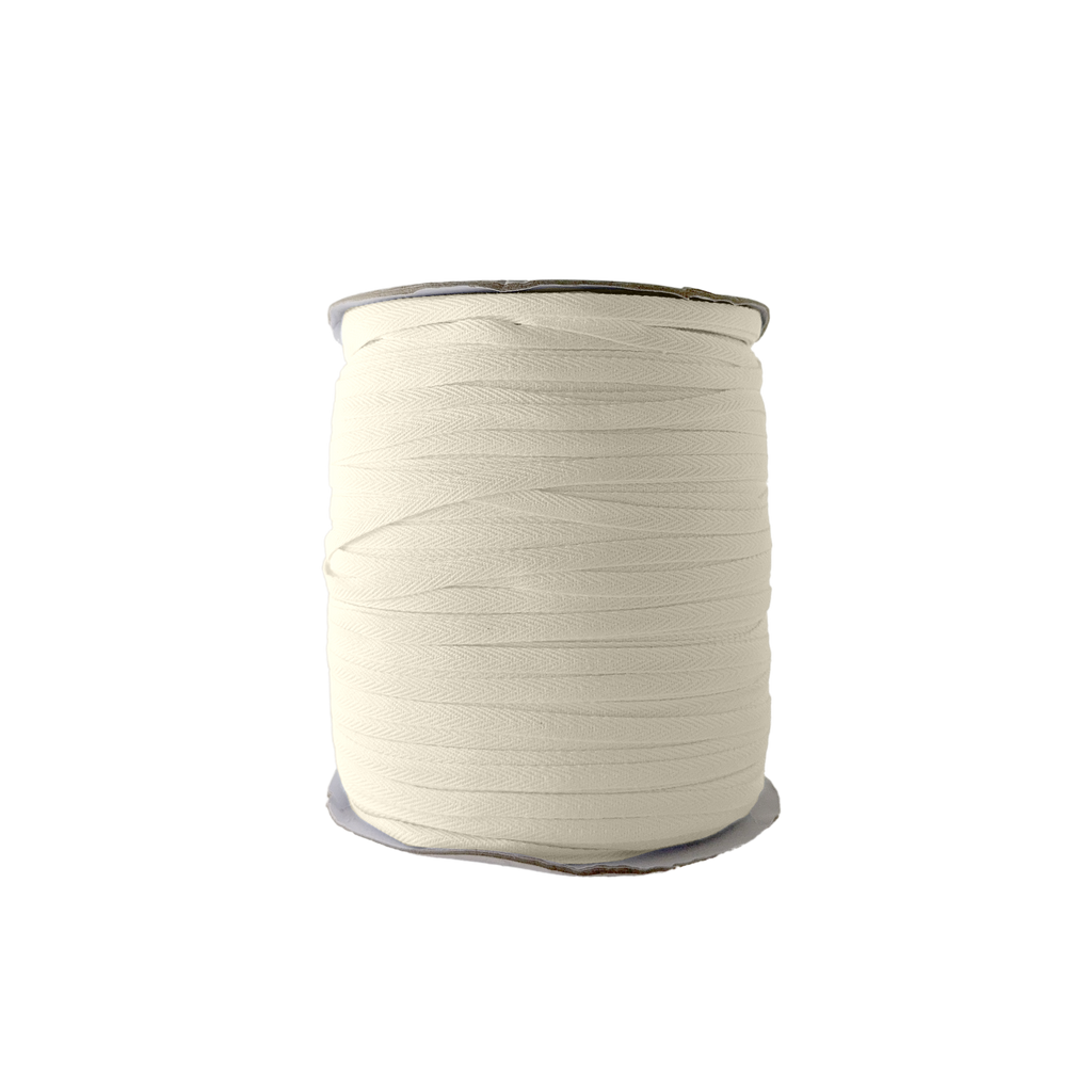 ivory 1/4" cotton twill tape on a spool from Heit's Wholesale bulk sewing supply company
