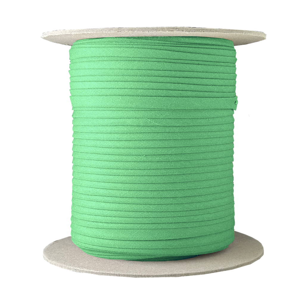 gypsy green 1/4" double fold bias tape on a spool from Heit's Wholesale bulk sewing supply company
