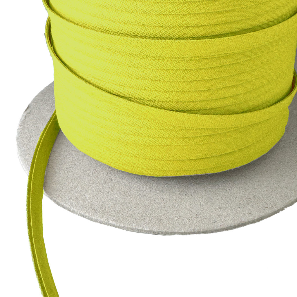 close up photo of khaki green 1/4" double fold bias tape on a spool from Heit's Wholesale