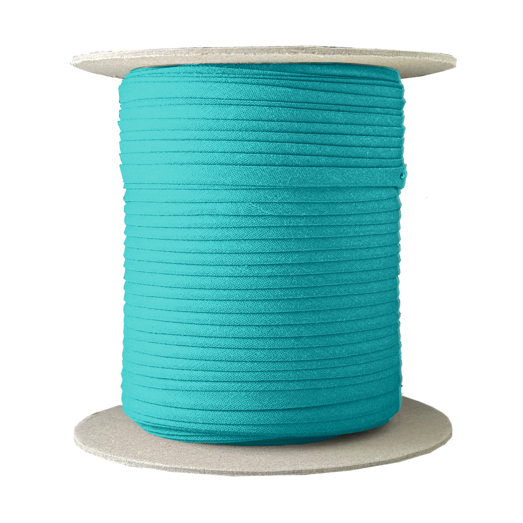 light teal 1/4" double fold bias tape on a spool from Heit's Wholesale bulk sewing supply company