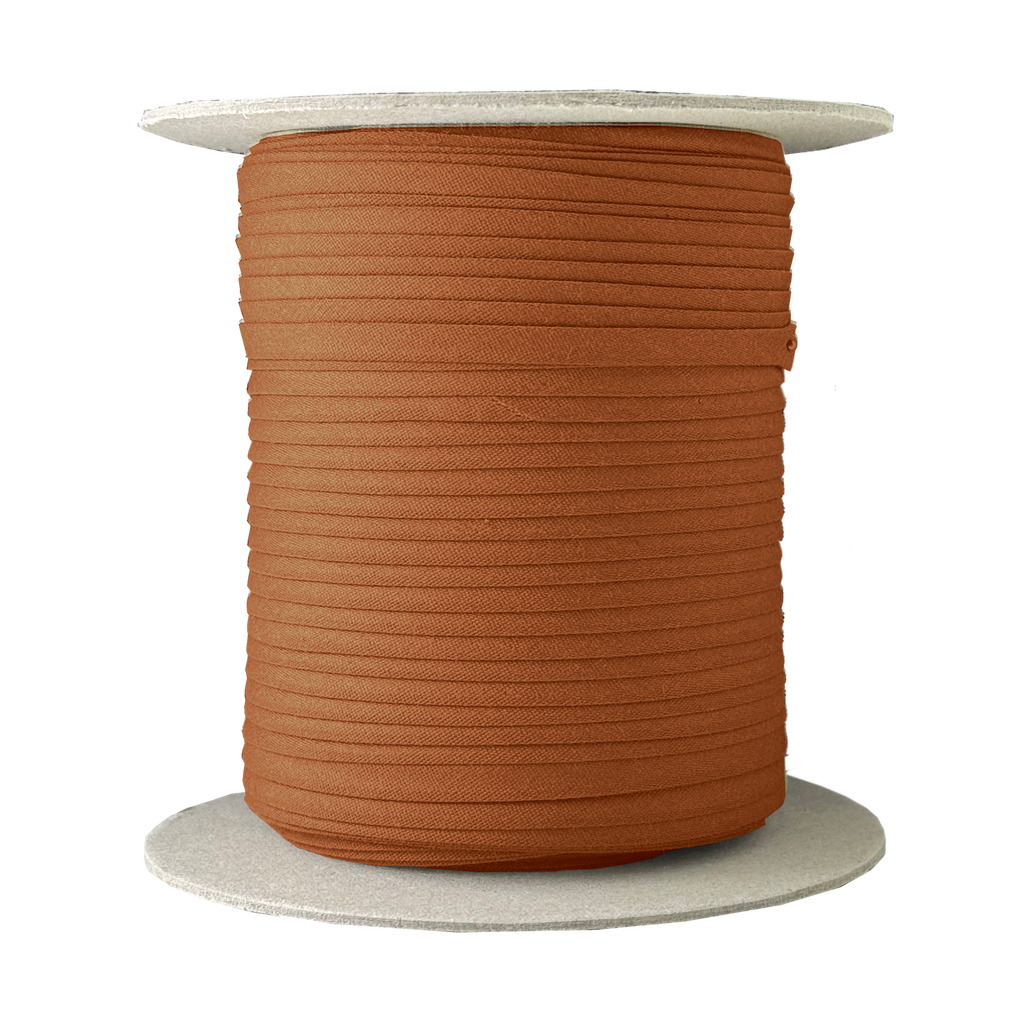 rust 1/4" double fold bias tape on a spool from Heit's Wholesale bulk sewing supply company