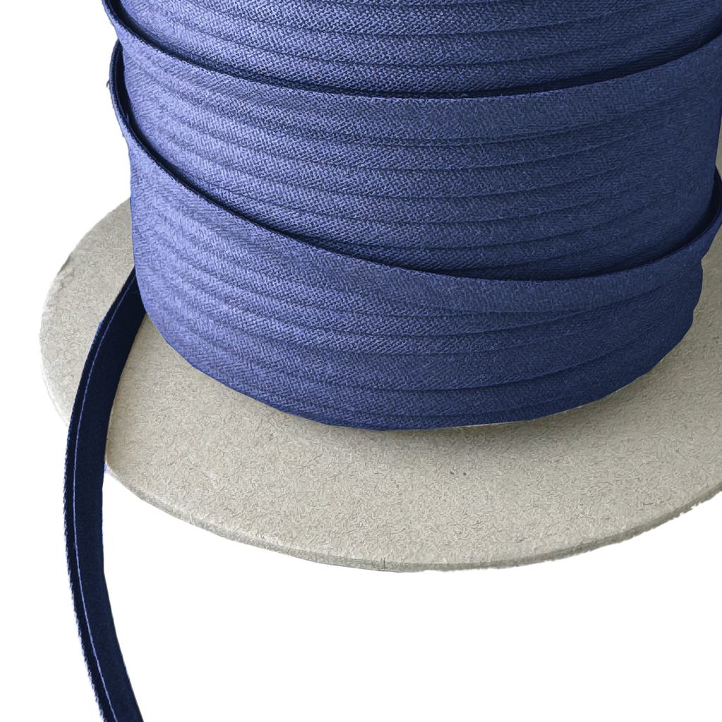 close up of the sailor navy 1/4" double fold bias tape on a spool from Heit's Wholesale bulk sewing supply company