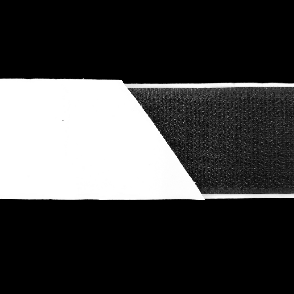 close up of the black 1+1/2" self-adhesive Velcro on a spool from Heit's Wholesale bulk sewing supply company