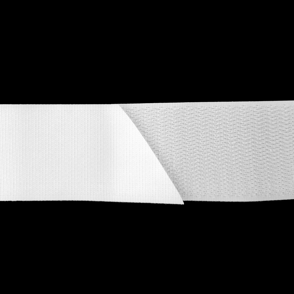 close up of the white 1+1/2" sew on velcro on a spool from Heit's Wholesale bulk sewing supply company