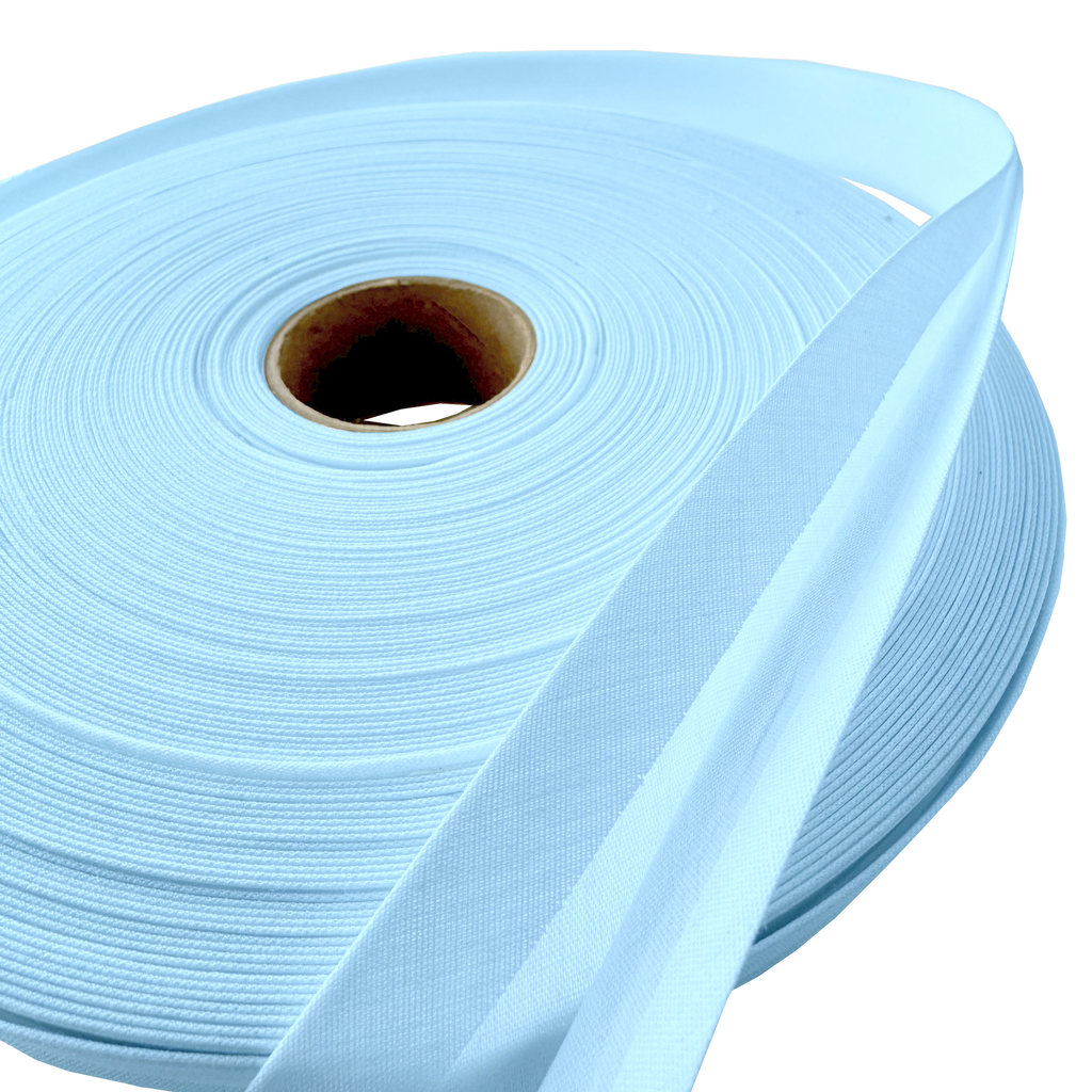 close up of the cloud blue 1" double fold bias tape on a roll from Heit's Wholesale bulk sewing supply company