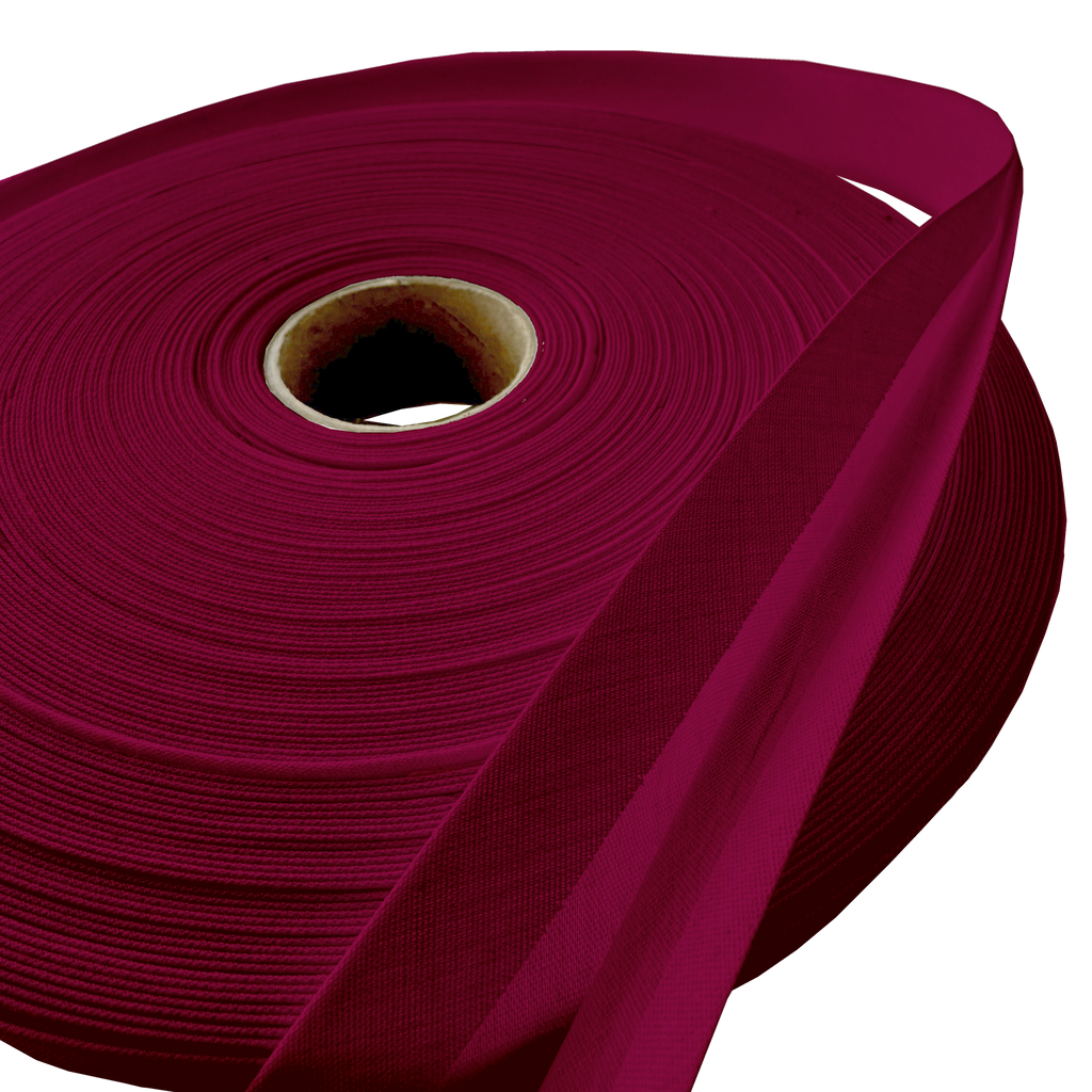 close up of the cranberry 1" double fold bias tape on a roll from Heit's Wholesale bulk sewing supply company