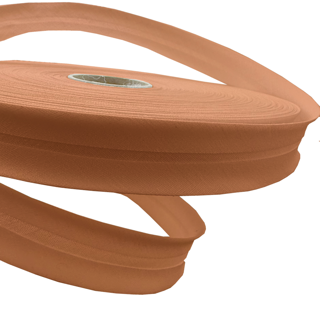 close up of the camel brown 1" no gap single fold bias tape on a roll from Heit's Wholesale bulk sewing supply company