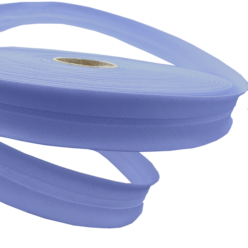 close up of the denim blue 1" no gap single fold bias tape on a roll from Heit's Wholesale bulk sewing supply company