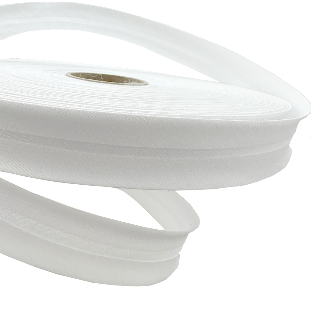 close up of the white 1" no gap single fold bias tape on a roll from Heit's Wholesale bulk sewing supply 