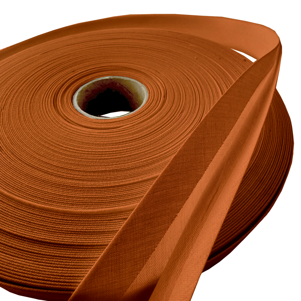 close up of the tarnish gold 1" double fold bias tape on a roll from Heit's Wholesale bulk sewing supply company