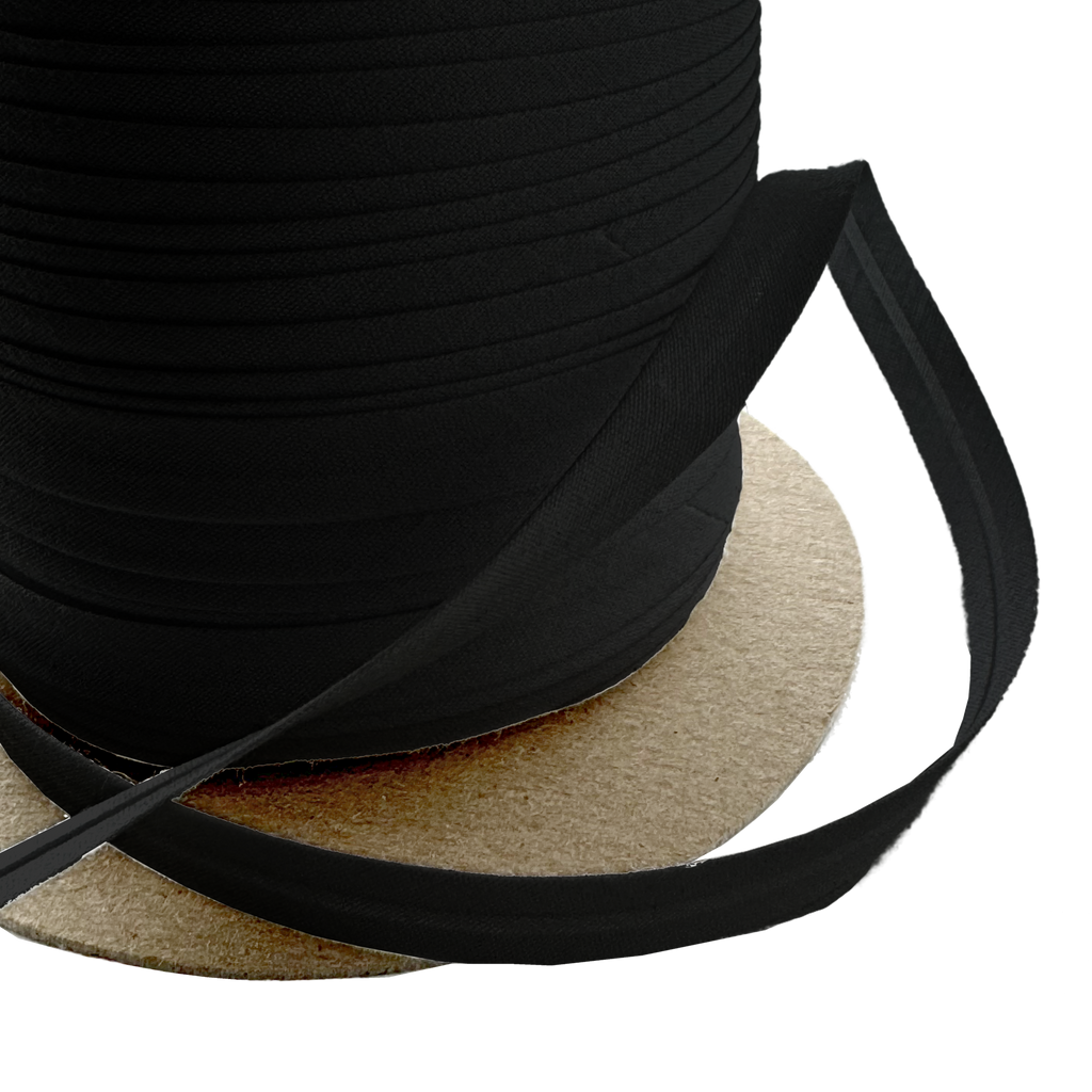 close up of the black 3/8" single fold bias tape on a spool from Heit's Wholesale bulk sewing supply company 