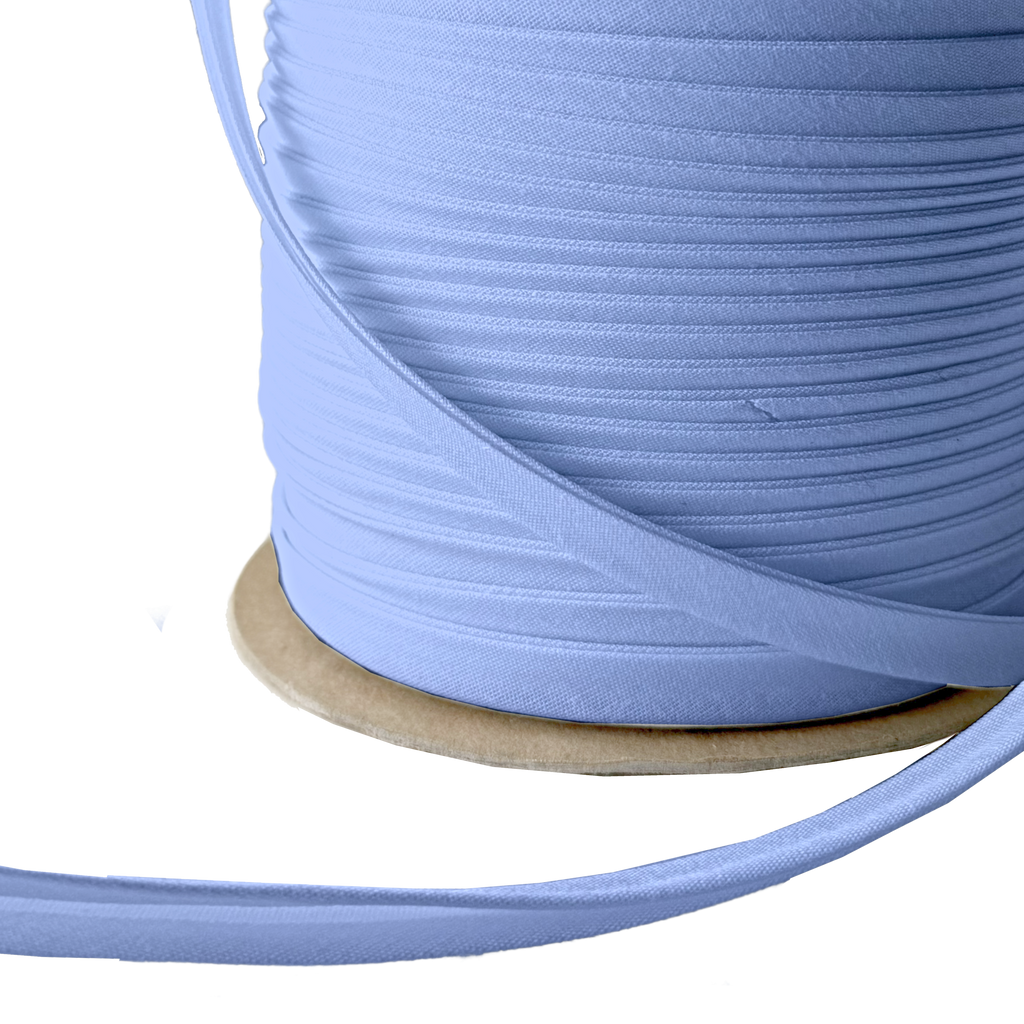 close up of the blue crest 3/8" double fold bias tape on a spool from Heit's Wholesale bulk sewing supply company 