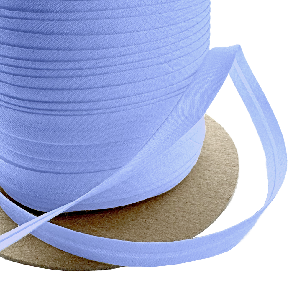 close up of the blue crest 3/8" single fold bias tape on a spool from Heit's Wholesale bulk sewing supply company
