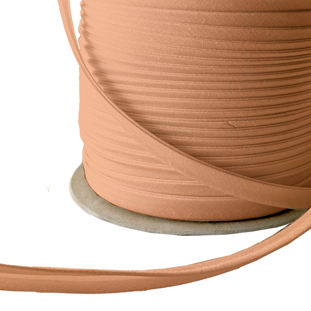 close up of the camel brown 3/8" double fold bias tape on a spool from Heit's Wholesale bulk sewing supply company 