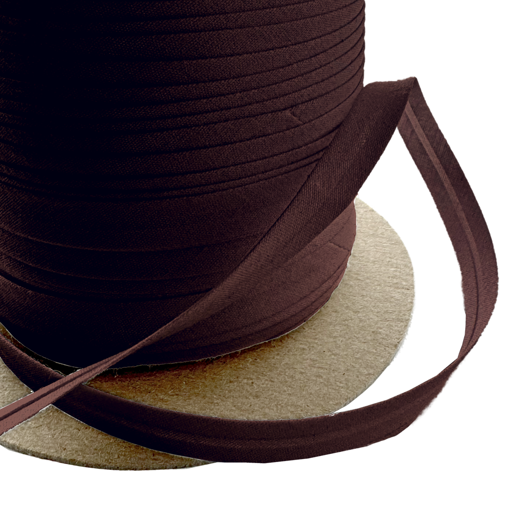 close up of the chocolate brown 3/8" single fold bias tape on a spool from Heit's Wholesale bulk sewing supply company
