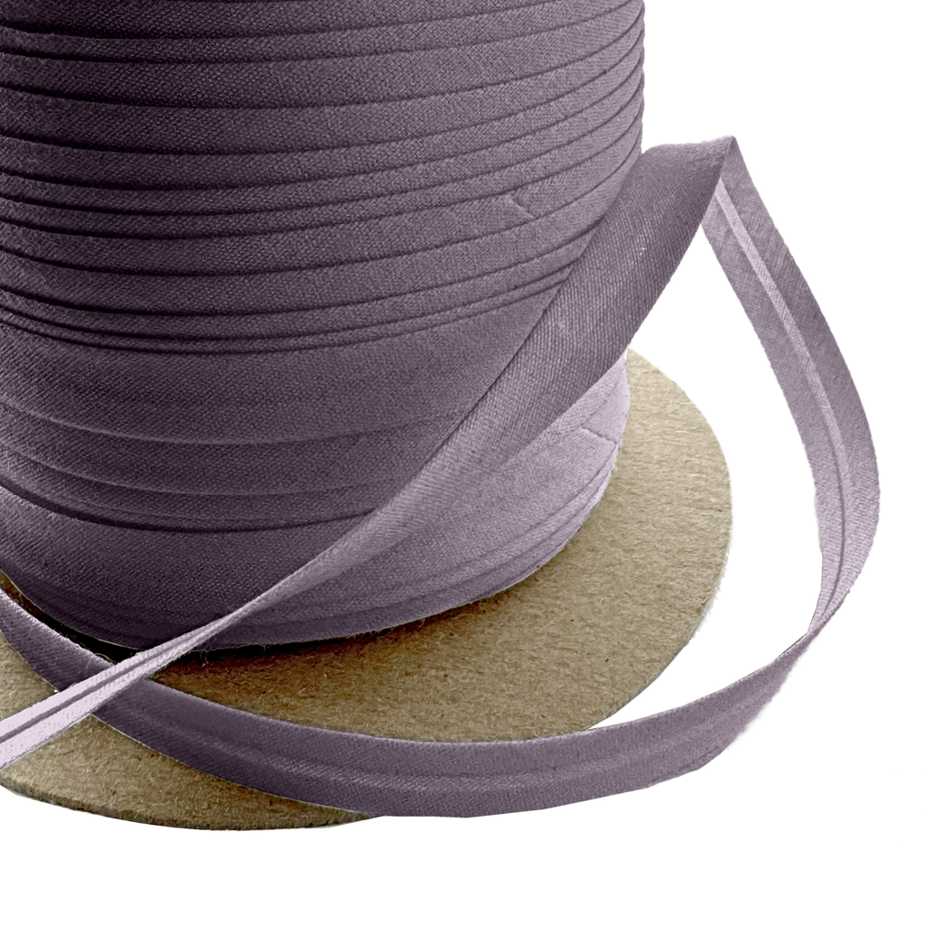 close up of the coal dust 3/8" single fold bias tape on a spool from Heit's Wholesale bulk sewing supply company