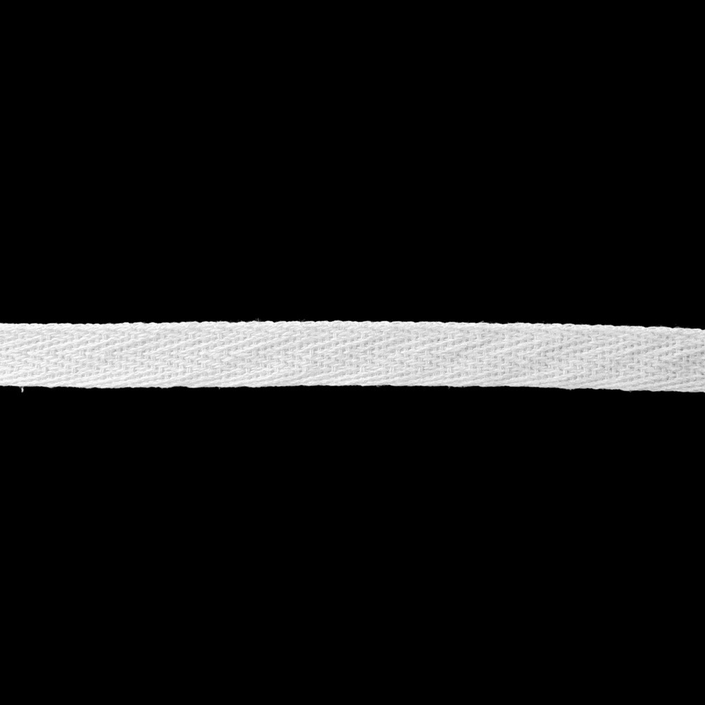 close up of the white 3/8" cotton twill tape on a spool from Heit's Wholesale bulk sewing supply company