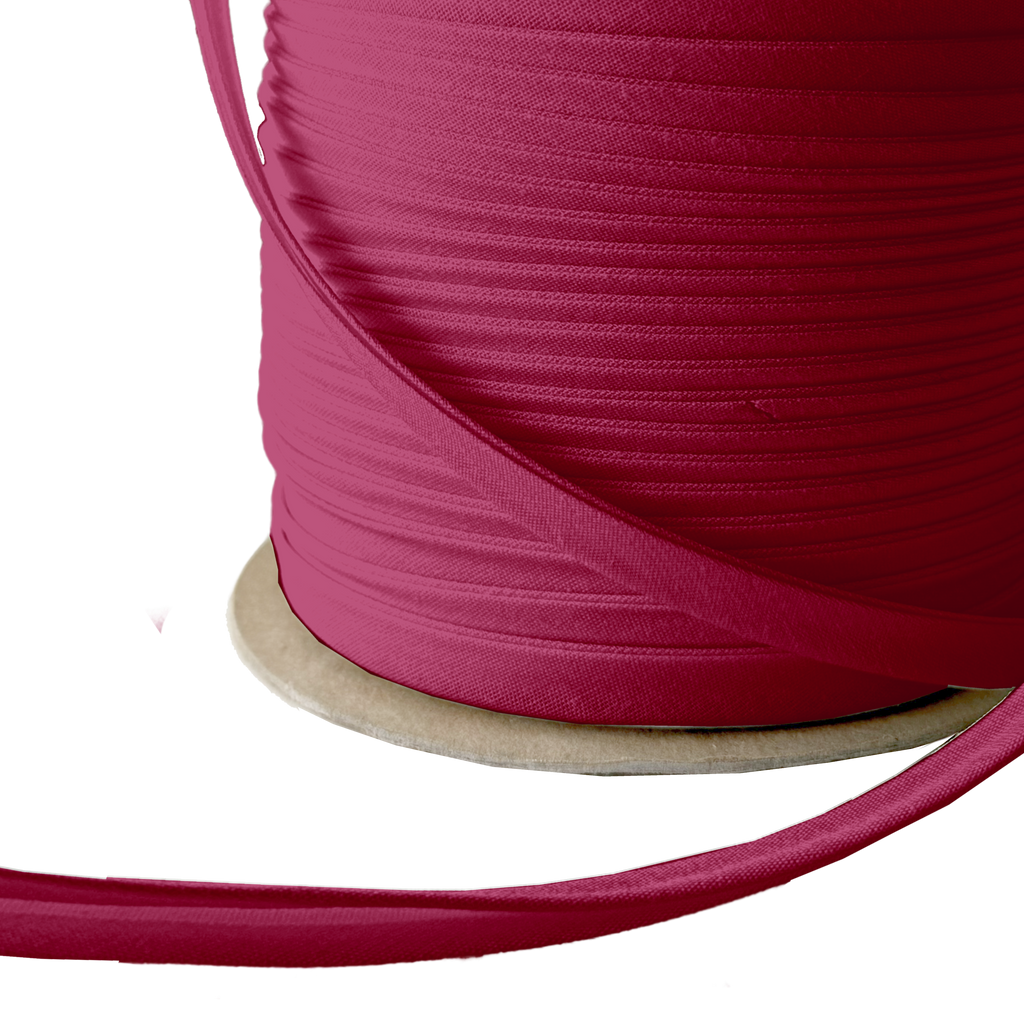 close up of the cranberry 3/8" double fold bias tape on a spool from Heit's Wholesale bulk sewing supply company 